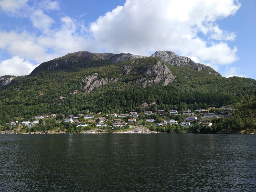 Beautiful coastline with norwegian houses and mountains in Stavanger, Norway. View. Beautiful coastline with norwegian houses and mountains in Stavanger, Norway. View.